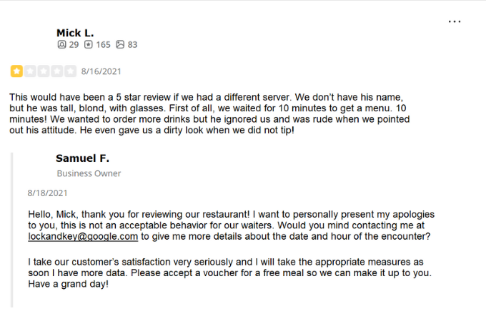 A one-star review from a customer with a response from the business owner apologizing and offering a free meal voucher